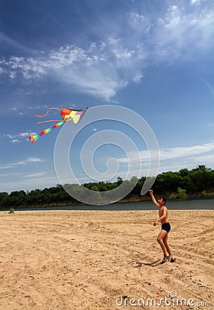 Boy running kite Stock Photo