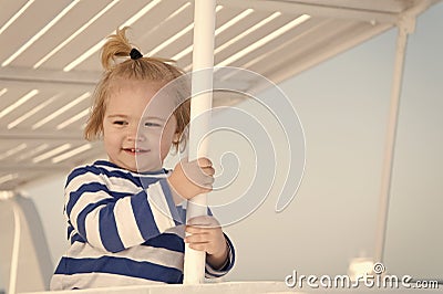 Boy sailor travelling sea. Child cute sailor enjoy journey on cruise liner. Kid adorable striped shirt yacht travel Stock Photo