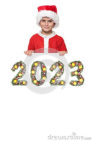 Santa Claus holds christmas poster and 2023 number Stock Photo