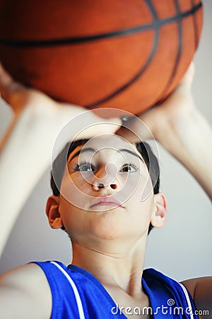 Boy Shooting Basketball Stock Photo