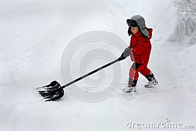 Boy shoveling snow Stock Photo