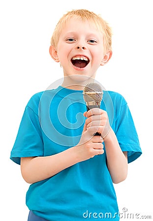 The boy sings with a microphone Stock Photo