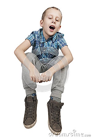 Boy sitting on white middle Stock Photo