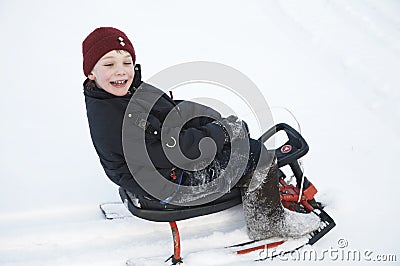 A boy on the sledge Stock Photo