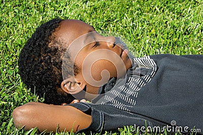 Boy Sleeping Grass Stock Photo