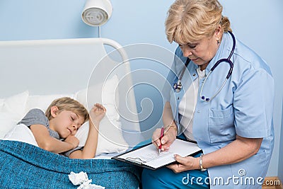 Boy sleeping in hospital bed Stock Photo