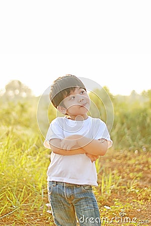 Boy smile happy in the morning, there is a backyard. Stock Photo