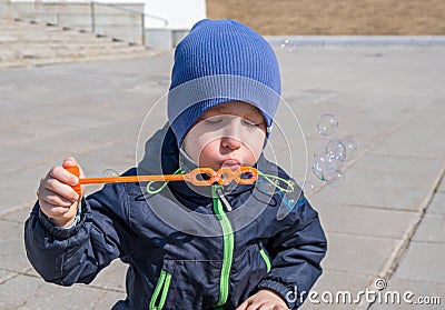 Boy with soap bubbles Stock Photo