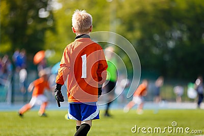 Boy Soccer Goalkeeper on the Field. Young Football Goalie on Kids Sports Competition Stock Photo