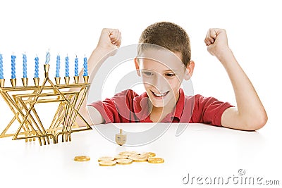 Boy Spinning the Chanukah Dreidel Stock Photo
