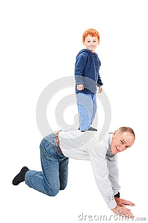 Boy standing riding grandfather back Stock Photo