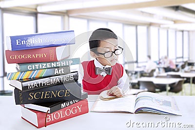 Boy study literature books at library Stock Photo