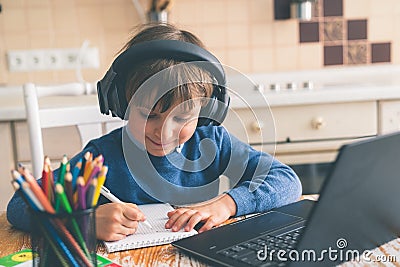Boy studying home online while school is closed Stock Photo