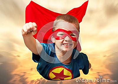 Boy in superhero costume guard the planet and show super abilities. Stock Photo