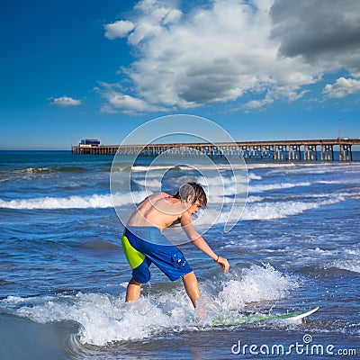 Boy surfer surfing waves on the Newport beach Stock Photo