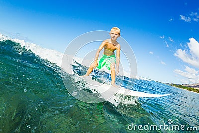 Boy Surfing Ocean Wave Stock Photo