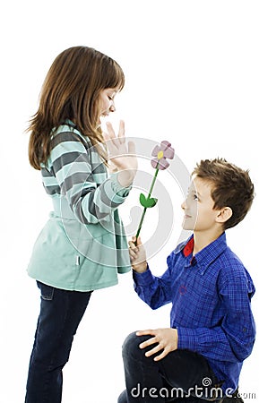 Boy surprising girl with flowers Stock Photo