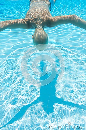 Boy swims face down Stock Photo