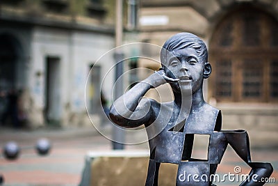 Boy talking on the mobile phone modern art sculpture in Liberty Square of Timisoara Editorial Stock Photo