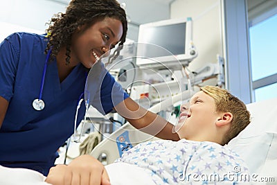 Boy Talking To Female Nurse In Emergency Room Stock Photo