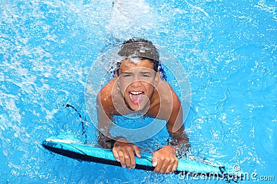 Boy teenager surfboard splashing blue water Stock Photo
