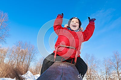 Boy on a teeter Stock Photo