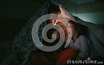 Boy telling a story to his sister Stock Photo