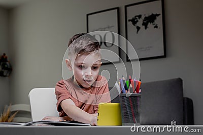 Boy is thinking about solving the problem. Mental arithmetic. Adding numbers Stock Photo