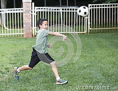 Boy throwing a soccer boy Stock Photo