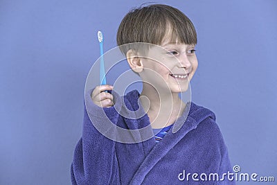the boy with the toothbrush. Health care, dental hygiene. Little boy cleaning teeth. Stock Photo