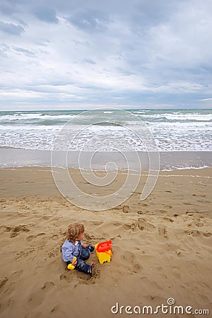 Boy with toy trowel bucket Stock Photo