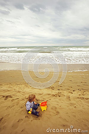 Boy with toy trowel bucket Stock Photo