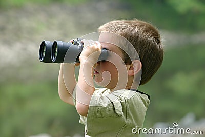 Boy Using Binoculars Stock Photo