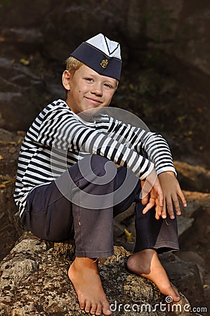 The boy in the vest and the marine cap Stock Photo