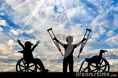 Boy in wheelchair and disabled boy standing with crutches day. Stock Photo