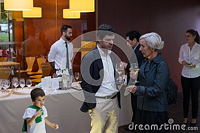 Wine tasting posh reception bar caucasian senior man woman boy reception restaurant Editorial Stock Photo