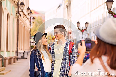 Boy with woman stand close and girl shooting them Stock Photo