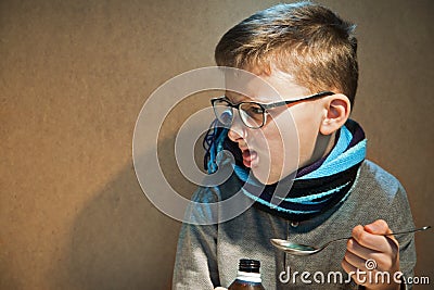 Boy 10 years was ill he did not want to drink the bitter syrup Stock Photo