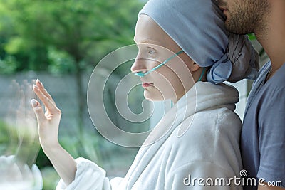 Hugging young woman with leukemia Stock Photo