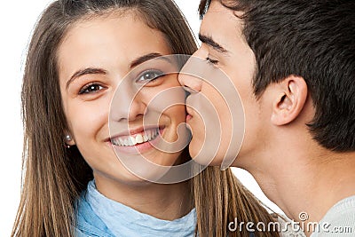 Boyfriend kissing girlfriend on cheek. Stock Photo