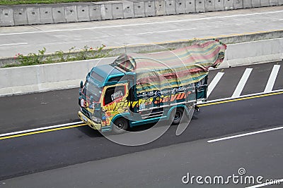 Mitsubishi Canter driving fast on the higway Editorial Stock Photo