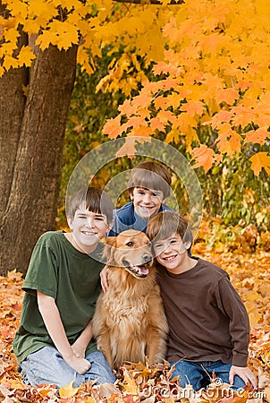 Boys in the Fall Leaves Stock Photo