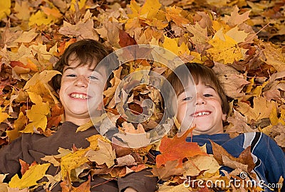 Boys in the Fall Leaves Stock Photo