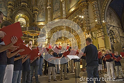 Boys & girls choir singing in the Benedictine Abbey at Montserrat, Santa Maria de Montserrat, near Barcelona, Catalonia, Spain wit Editorial Stock Photo