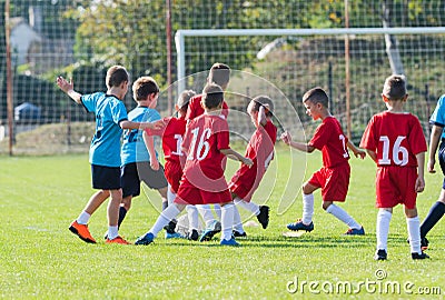 Boys kicking ball Stock Photo