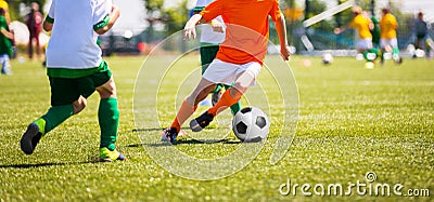 Boys Kicking Soccer Ball. Children Soccer Team. Running soccer players Stock Photo