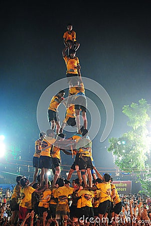 Boys perform Human Towers in Mumbai Maharashtra during Dahi Handi Editorial Stock Photo