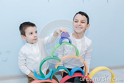 Boys play in different intelectual games in preschool classroom Stock Photo