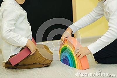 Boys play in different intelectual games in preschool classroom Stock Photo
