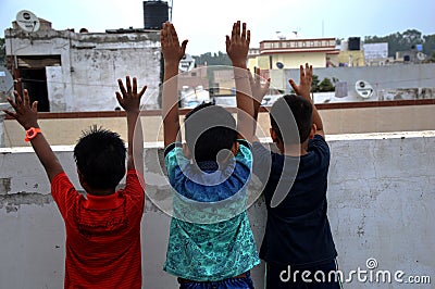 Boys playing on house roof Editorial Stock Photo